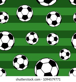 Seamless pattern of big soccer balls on striped background in green colors
