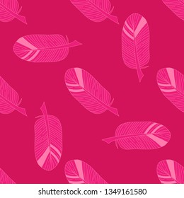 Seamless pattern of bird feathers on pink background