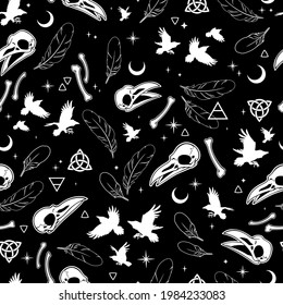 seamless pattern of bird, skulls and feathers