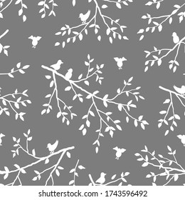 Seamless pattern with birds and branches of tree. Tree branches with leaves on a gray background. Spring or summer background. Vector illustration