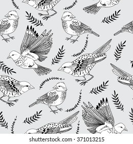 Seamless pattern with birds and branches. Vector illustration.