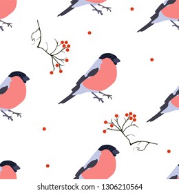Seamless pattern of birds bullfinch on a white background and rowan