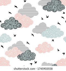 Seamless pattern with birds and clouds
