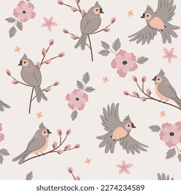 Seamless pattern with birds and pink flowers. Vector graphics.