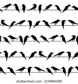 Seamless pattern with birds seating on wires
