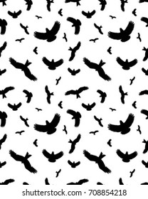 Seamless pattern of birds silhouettes on a white background