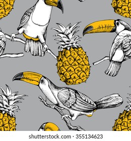 Seamless pattern with birds toucans on the branches and pineapples on a gray background. Vector illustration.