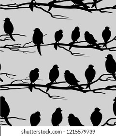 Seamless pattern with birds.Birds on branches.Vector illustration. Silhouettes.Horizontal direction.Naive drawing.Background for Wallpaper, postcard, paper, fabric, web page.