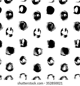 Seamless pattern from black abstract handdrawn circles isolated on a white background