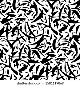 Seamless pattern of black artistic rough, dry pieces, brush hatches, stains