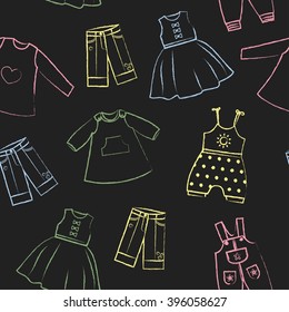 Seamless pattern black background with cute colored dresses for the little girl. Collection of clothing in a linear style for the child. Hand-drawn style. Seamless vector wallpaper