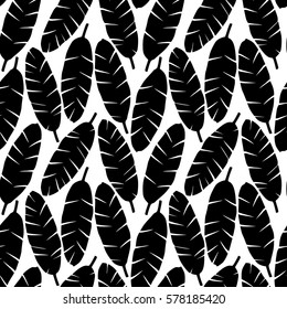 Seamless pattern of black banana leaves on white. Tropical wallpaper, textile print, exotic background.