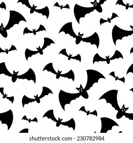 Seamless pattern with black bats on white background