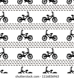 Seamless pattern with black bicycles on the white background. Vector illustration