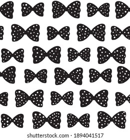 Seamless pattern with black bows in polka dots on a white background.Scandinavian style.Stock vector illustration.