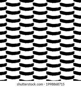 Seamless pattern with black brushstrokes in abstract shapes on white background. Abstract ink grunge texture. Vector illustration