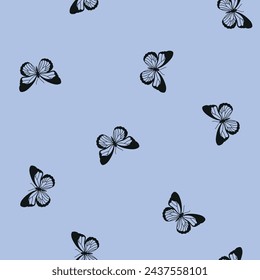Patrón sin costuras con mariposas negras y fondo azul