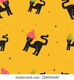 Seamless pattern with a black cat on a yellow background. Festive autumn wallpaper. Autumn season.