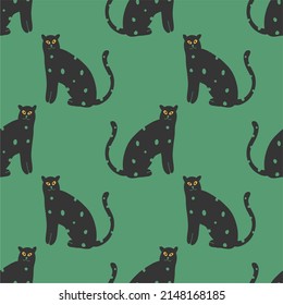 Seamless pattern with black cats on a green background. Flat design, hand drawn cartoon, vector illustration. Template for printing.