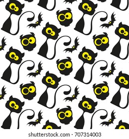 Seamless pattern with black cats and owls.