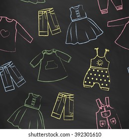 Seamless pattern black chalk board with cute dresses for the little girl. Collection of clothing in a linear style for the child. Hand-drawn style. Seamless vector wallpaper