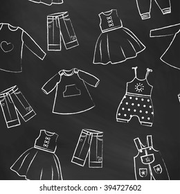 Seamless pattern black chalk board with white cute dresses for the little girl. Collection of clothing in a linear style for the child. Hand-drawn style. Seamless vector wallpaper