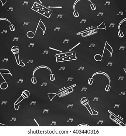 Seamless pattern black chalk board with white children's chalk drawings. Hand-drawn style. Seamless vector wallpaper with the image of  drum, microphone, pipe, headphones and note