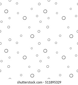 Seamless pattern with black circles on a white background
