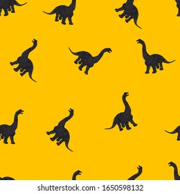 Seamless pattern with black dinosaur on yellow background. For textile and fabric.