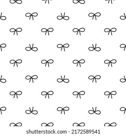 Seamless pattern with black doodle bows