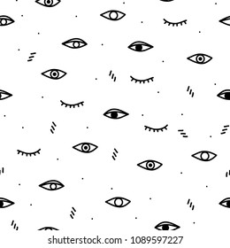 Seamless pattern with black eyes on a white background.