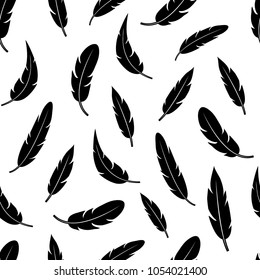 Seamless pattern with black feathers isolated on white background. Vector illustration