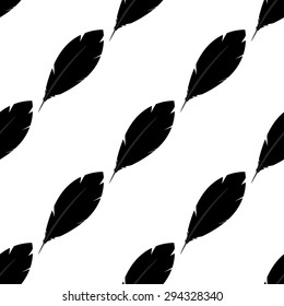 Seamless pattern: black feathers on a white background. Black and white.