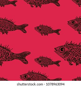 Seamless pattern of black fish on a red background