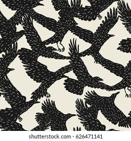 Seamless pattern with black flying ravens. Hand drawn inky birds.