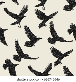 Seamless pattern with black flying ravens. Hand drawn inky birds.