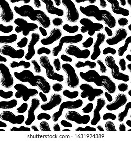 Seamless pattern with black formless shapes. Vector abstract ink brush strokes background. Hand drawn texture for wallpaper, web banner, wrapping paper, textile. Brushstroke, scribbles, smear pattern.