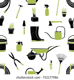 Seamless pattern with black and green gardening tools on white background. Backdrop with equipment for crops cultivation, agricultural work and growing plants. Vector illustration for wallpaper.