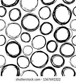 Seamless pattern of black hand drawn circles, elements for design on white background. Hand-drawn painted elements. Vector illustration.