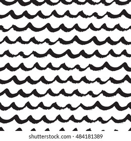 Seamless pattern with black hand drawn waves in grunge style. Abstract background with wavy brush strokes. Black and white texture. Ornament for wrapping paper.