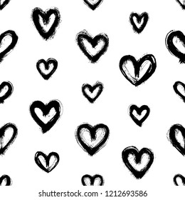 Seamless pattern with black hand-drawn in ink uneven messy hearts isolated on white background. Doodle style abstract grunge texture.