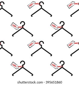 Seamless pattern with black hangers and labels with inscription sale on the white background