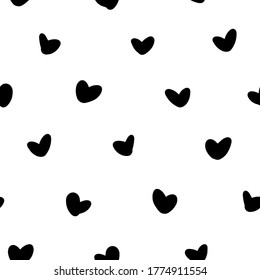 Seamless pattern with black hearts on a white isolated background.  Stylized blots and abstract ink. Great for fabric, wallpaper, textile, wrapping Valentine's Day.