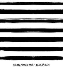 Seamless pattern from black horizontal abstract long textured brush strokes on a white background