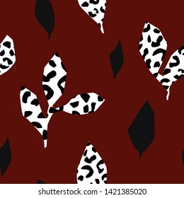 Seamless pattern with black and leopard leaves