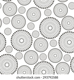 Seamless pattern with black mandala on white background. Round ornament.