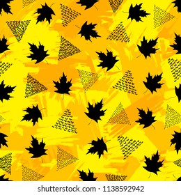 Seamless pattern with black maple leaves and triangles on the colorful brush painted background . Vector illustration