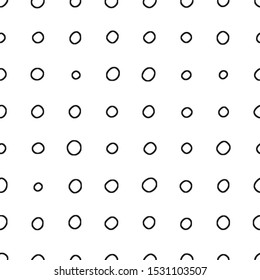 Seamless pattern. Black on a white background, circles of irregular shape and different sizes.