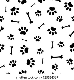 Seamless pattern of black paw prints dog and bones on white background footprints wallpaper