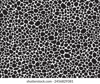 Seamless pattern of black pebbles arranged in a random organic pattern on a white background